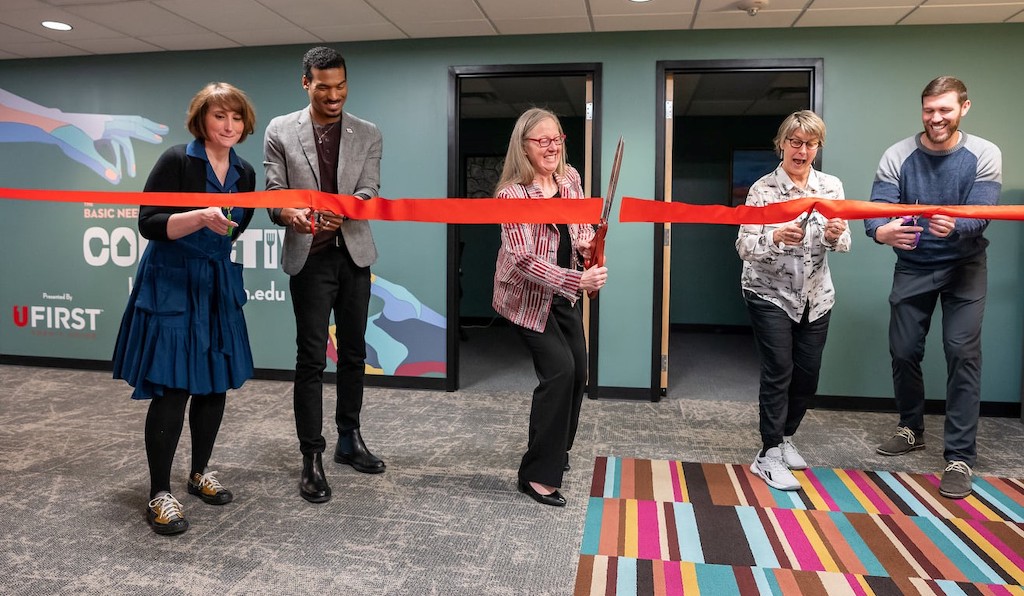 photo of University of Utah executives cutting a red banner in celebration of the opening of Basic Collective at University of Utah