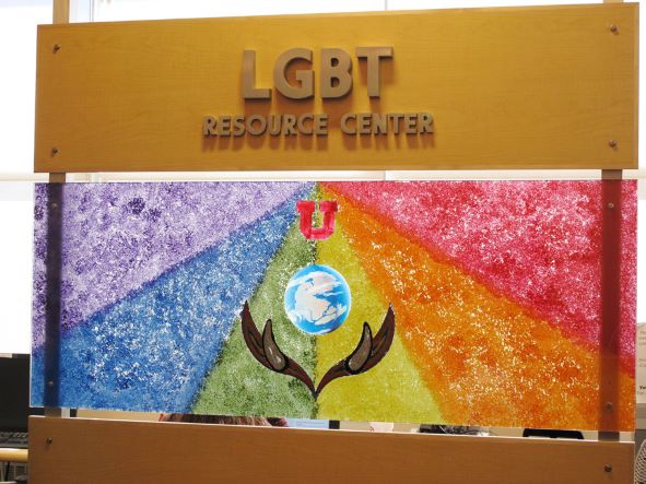 rainbow painting below the LGBT Resource Center sign.